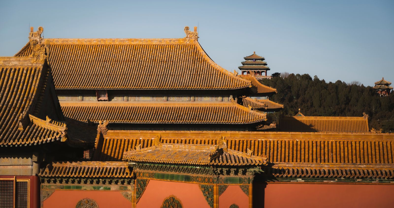 Golden rooftops of the Forbidden City in Beijing at sunset