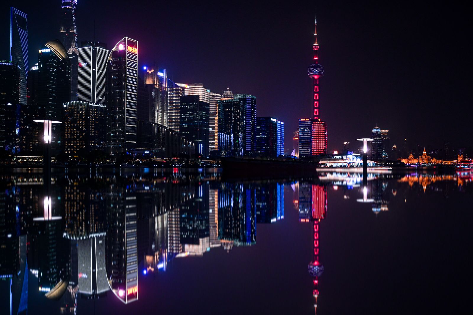 The Pudong skyline at night, seen across the Huangpu River